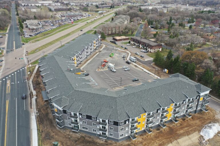 An aerial roofing photo displaying an apartment building project