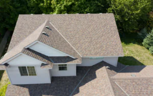 Drone-shot image showing a home's brown roof