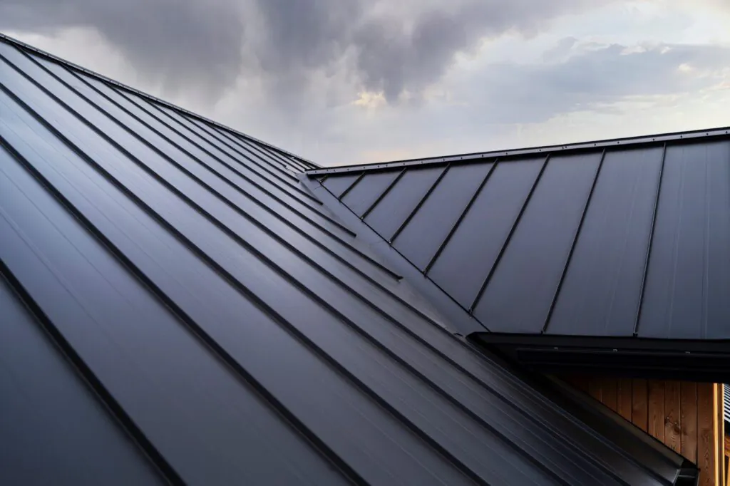 Black metal roofing used atop a wood building