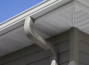 Gutters seen on the corner of a home's roof
