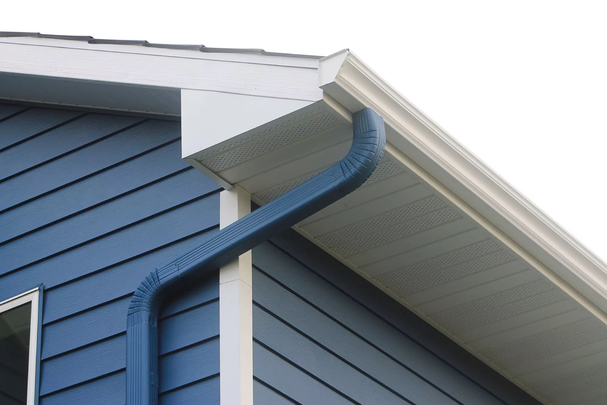 White and blue gutters on a blue home