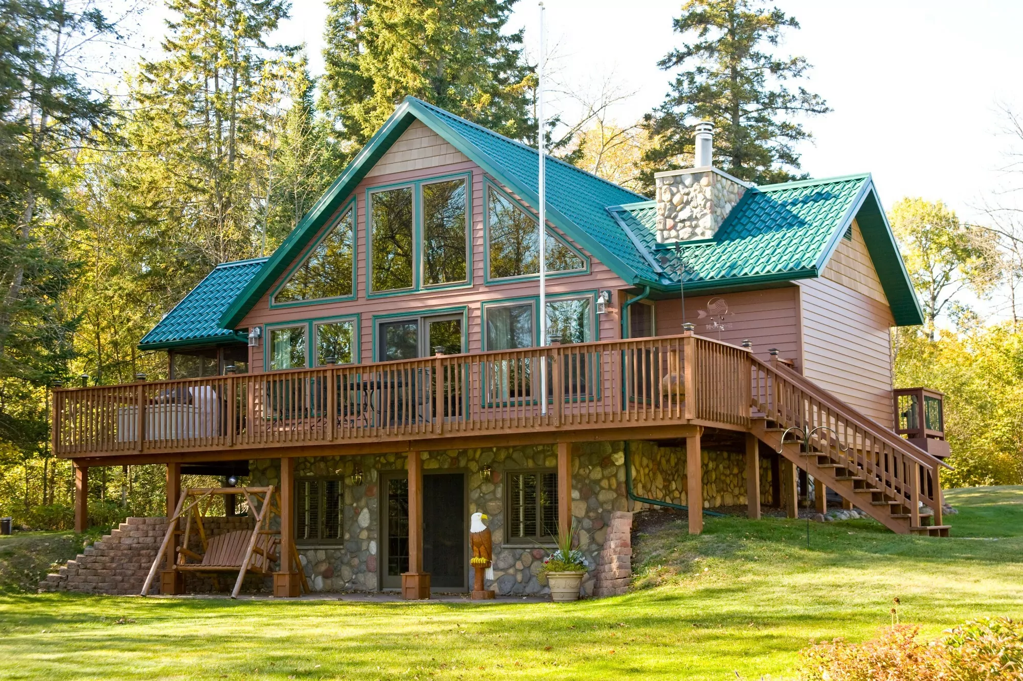 Large cabin style home with steel siding and roofing