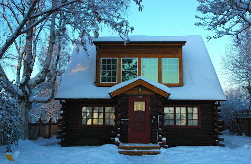Home exterior with snow and ice build up