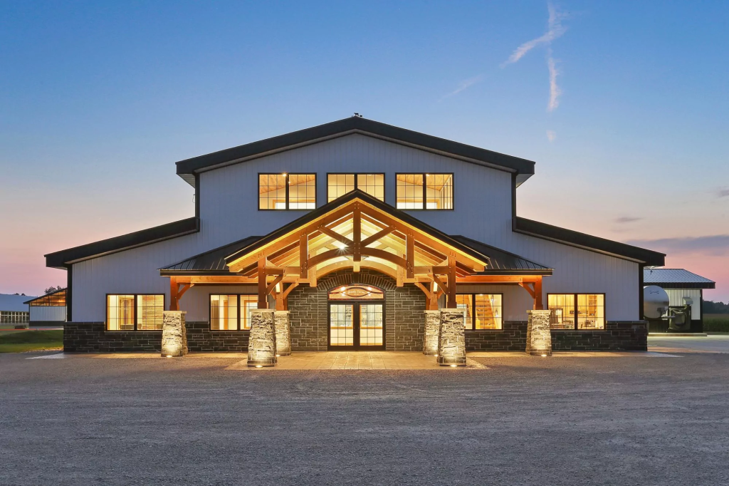 Durable pole barn siding installed on a large barn structure by Committed Roofing & Exteriors.