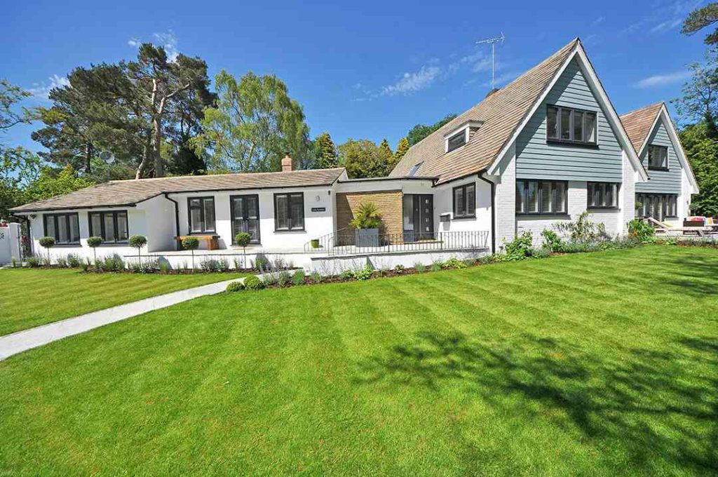 Residential property showcasing roofing and siding work by Committed Roofing & Exteriors.