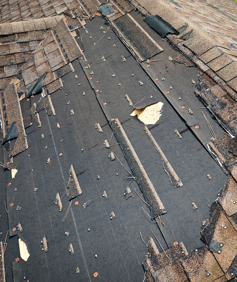 damaged house roof with missing shingles after hur 2026 01 07 02 06 26 utc
